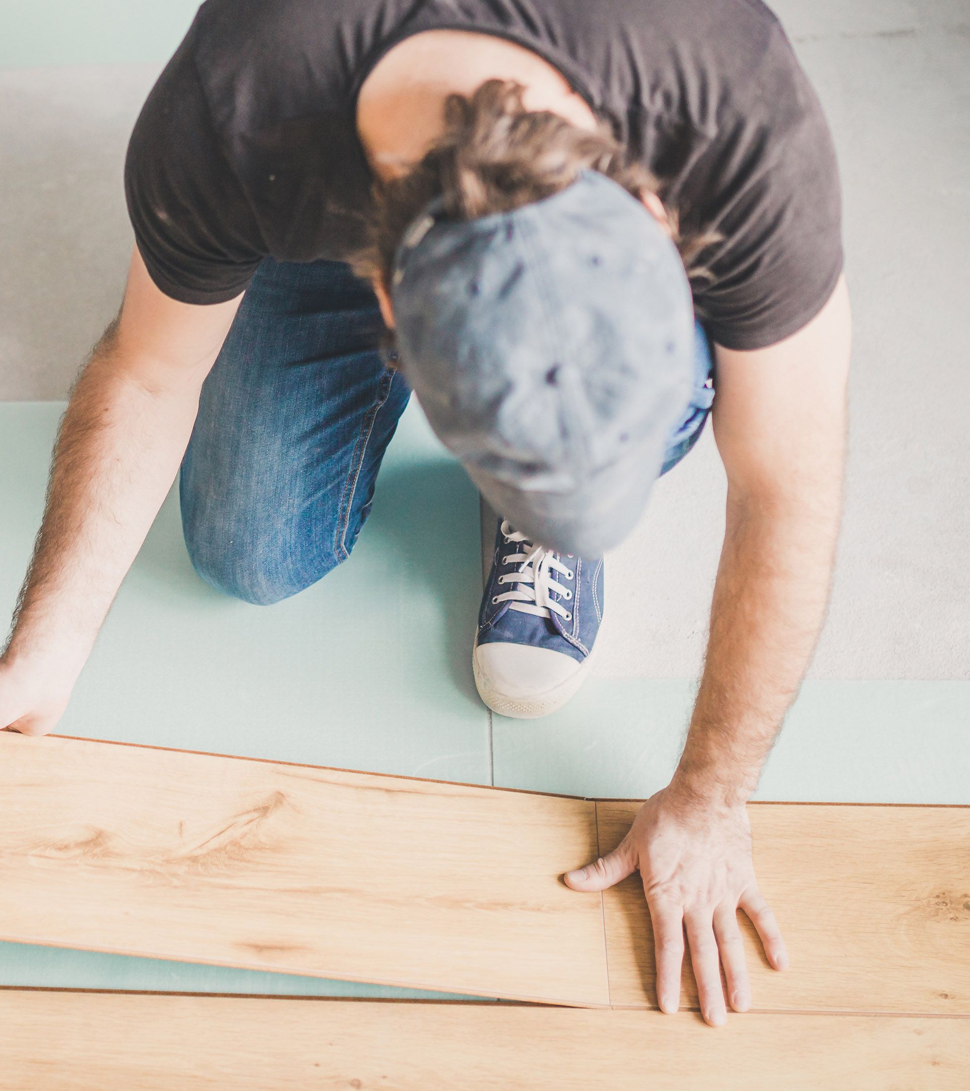 Man installing hardwood flooring