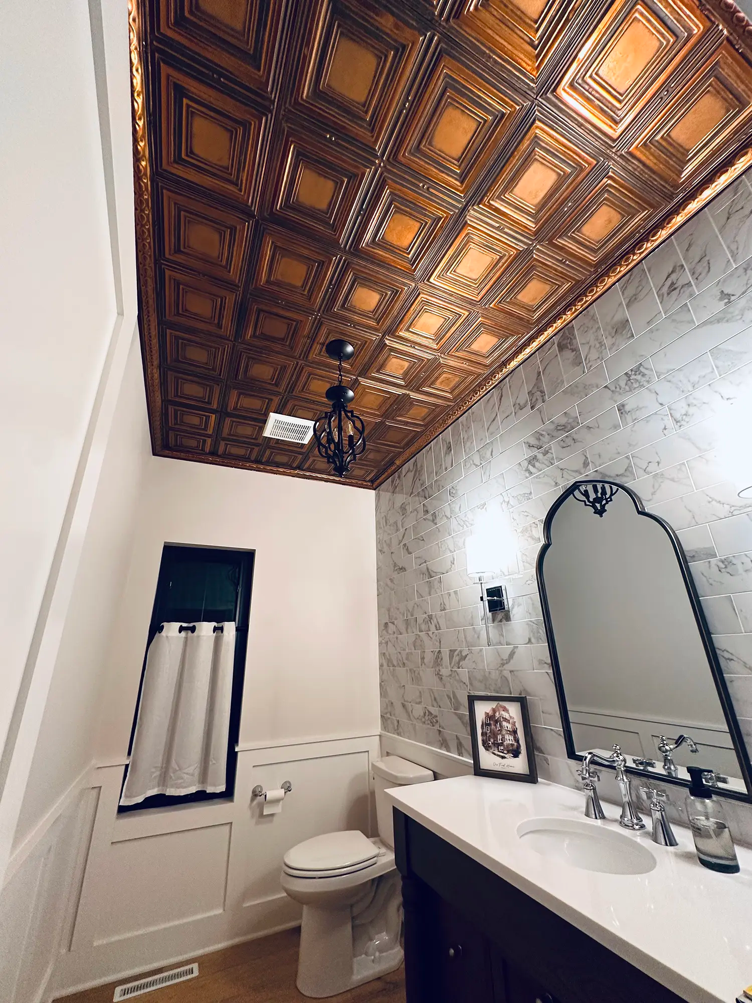 Tiled backsplash with textured tile ceiling